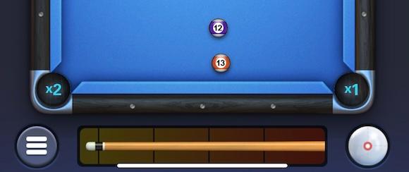 An 8 Ball Strike screenshot showing how the cue control strip overlaps with the iOS Home Bar.