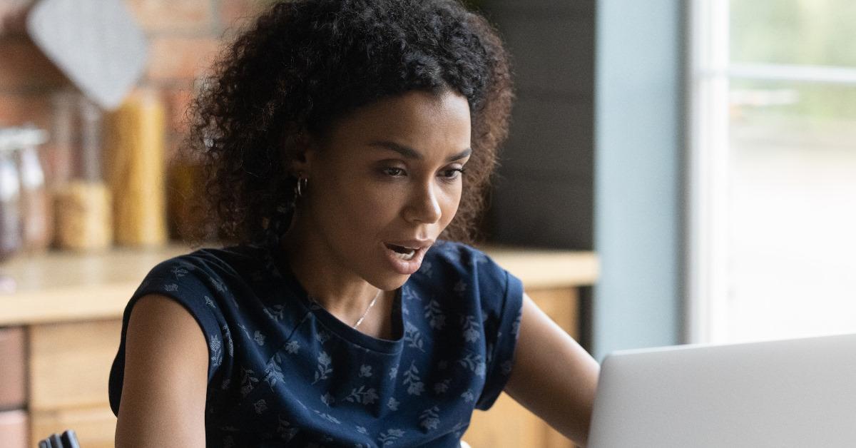 african american woman shocked at laptop