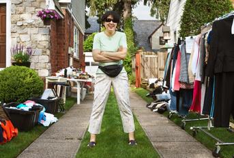 woman welcoming clients to yard sale