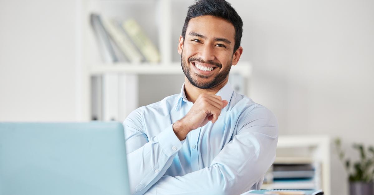 businessman smiles in office