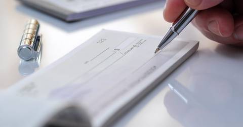 Writing out a check with a pen