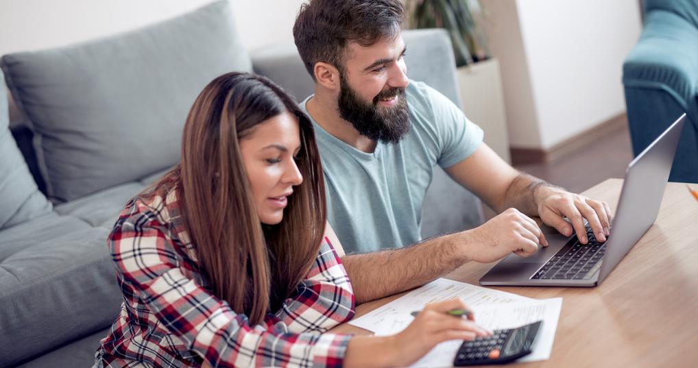 Couple budgeting at coffee table
