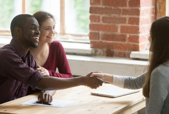 a couple having a meeting with an advisor