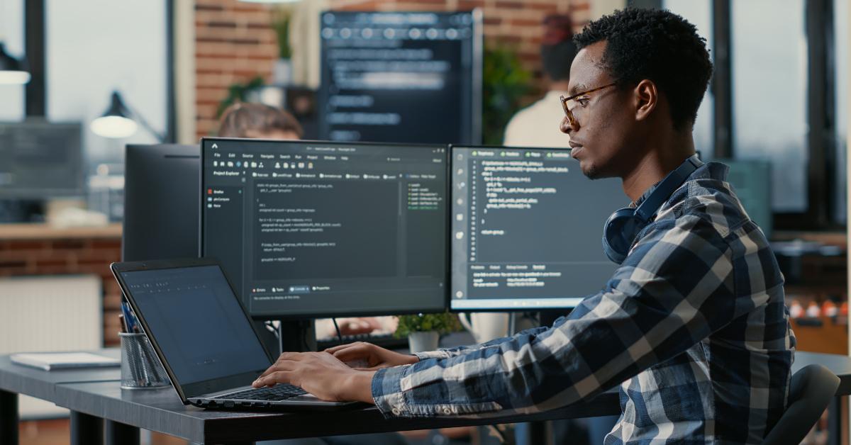 developer using laptop to write code