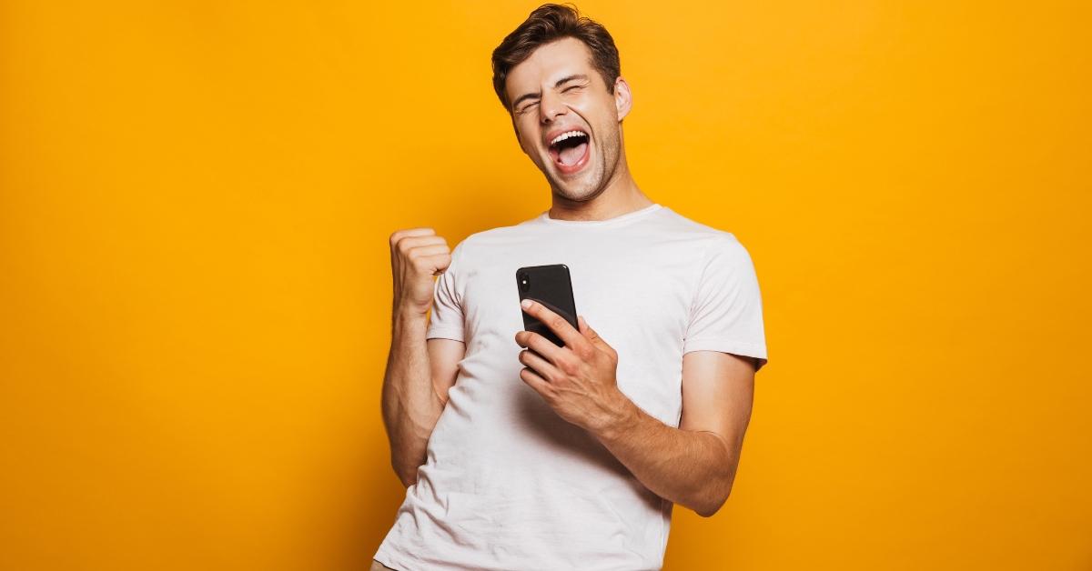 Excited man with phone