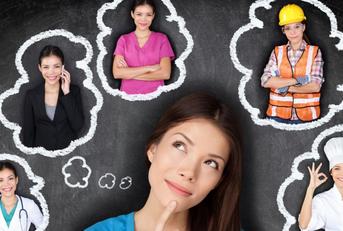 female student standing in front of black background think about available career options