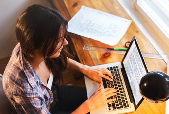 female student working on laptop