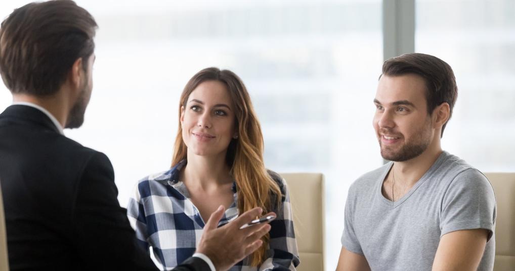 Couple talking with a lender