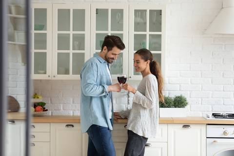 Happy couple in their kitchen