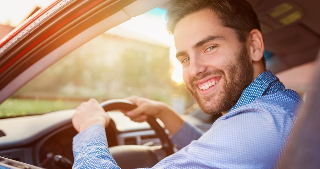 Happy man driving car