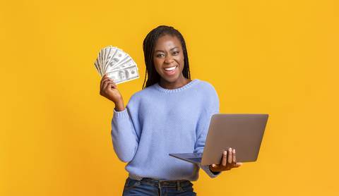 Happy woman holding money