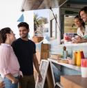 Happy people at a food truck