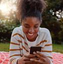 Happy woman looking at phone