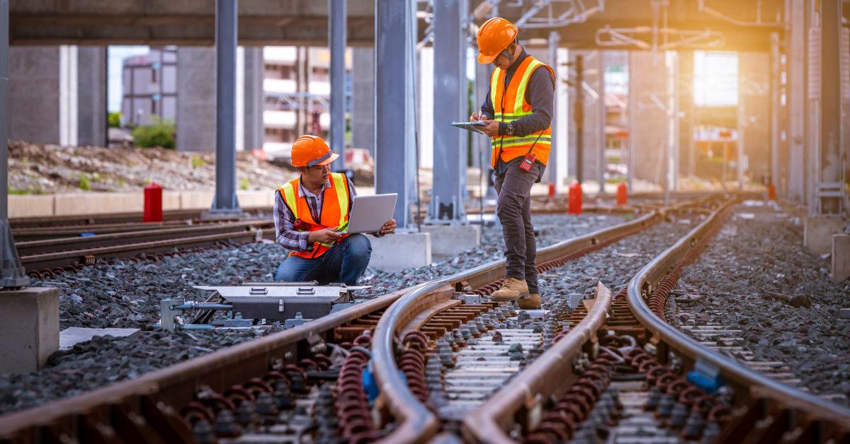engineers inspecting railway switch