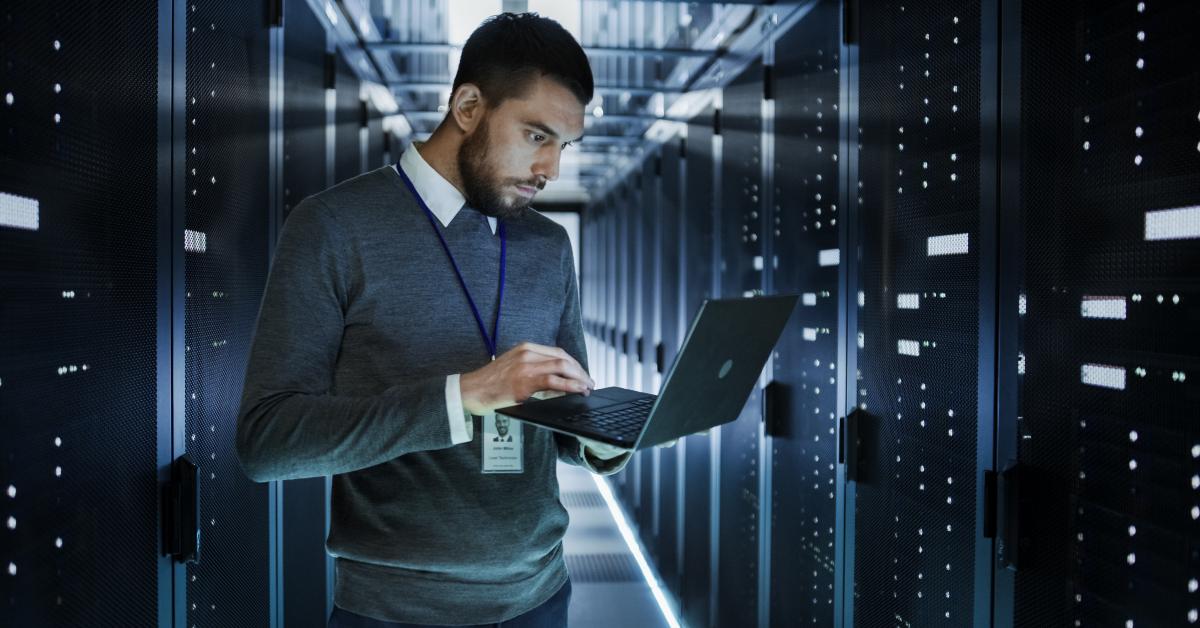 it technician works on a laptop