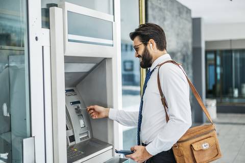 Man using ATM