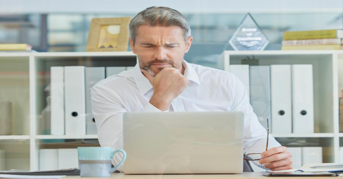 mature buisnessman using laptop at work