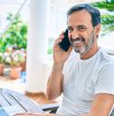 middle age man with beard smiling happy at the terrace 