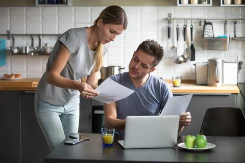 Serious couple looking at finances