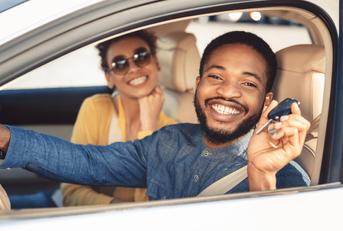 Smiling couple in a car