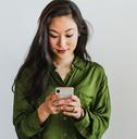 Smiling woman looking at phone