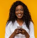 Smiling woman using phone