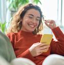 Woman playing on mobile phone