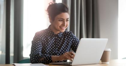 woman researching on her laptop