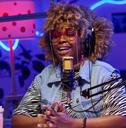 A woman recording a podcast episode