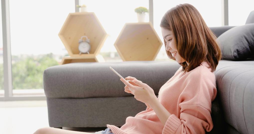 Woman watching videos on smartphone