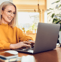 A woman uses her laptop at home.