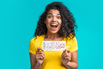 Woman holding lottery ticket